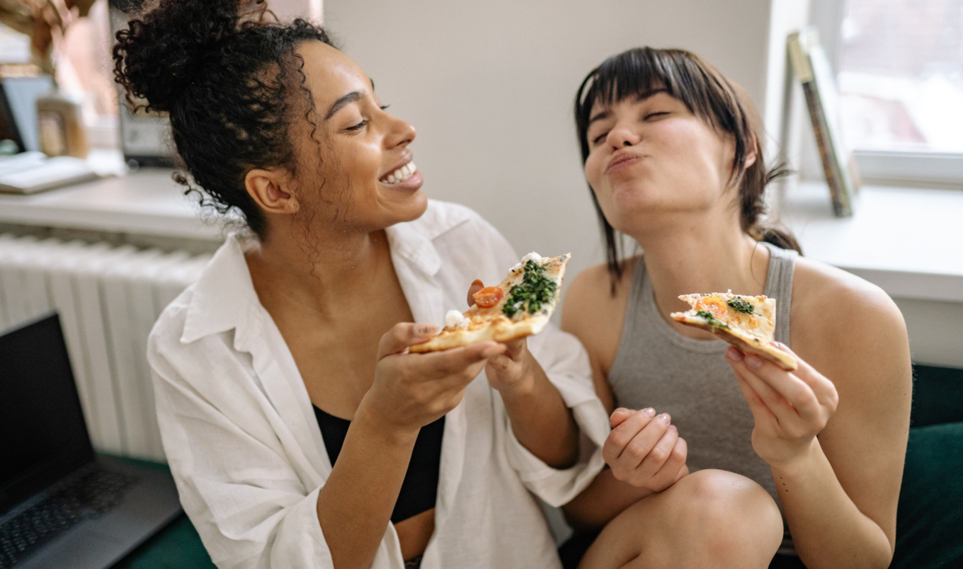 woman eating pizza